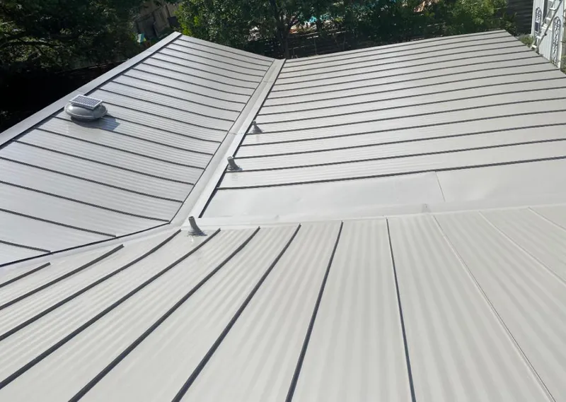 Solar attic fan installed on a metal roof for Roof Ventilation in Kinderhook